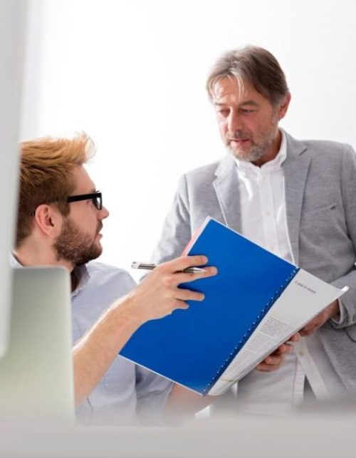 Two businessmen talking in office